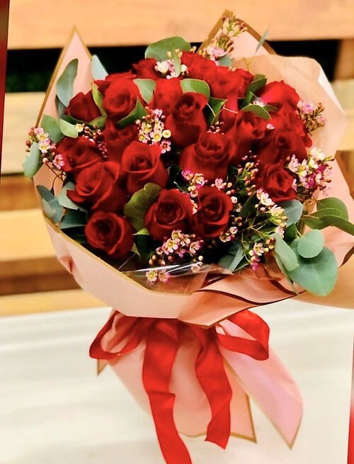 Two doz red roses wrap bouquet