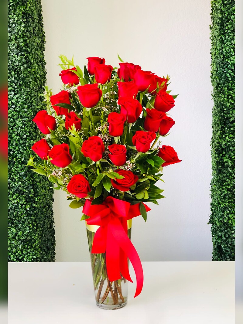 Two dozen long stem red roses bouquets arranged by a florist in Las